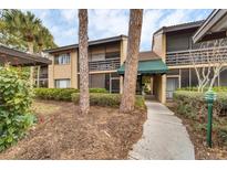 Condo building exterior with walkway, landscaping, and parking at 5671 Ashton Lake Dr # 3, Sarasota, FL 34231