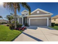 One-story home with attractive landscaping and a two-car garage at 12426 Tranquility Park Ter, Bradenton, FL 34211