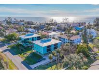 Aerial view of beach town homes, showcasing oceanfront location and proximity to beach at 3704 6Th Ave # 5, Holmes Beach, FL 34217
