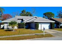 Charming one-story house with gray roof and landscaping at 3727 75Th E Dr, Sarasota, FL 34243