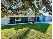 Newly renovated home with a landscaped lawn and inviting curb appeal at 5303 14Th Avenue W Dr, Bradenton, FL 34209