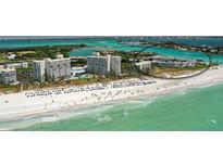 Aerial view of beachfront property with resort amenities and stunning ocean views at 100 Sands Point Rd # 323, Longboat Key, FL 34228