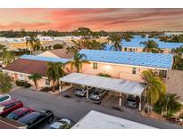 Aerial view of condo community showing building exteriors, parking, and landscaping at 6238 7Th W Ave # 6238, Bradenton, FL 34209