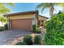 Single-story home with attached garage and well-manicured landscaping at 6739 Haverhill Ct, Lakewood Ranch, FL 34202