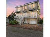 Two-story house with double doors, balconies, and a two-car garage at 3524 Walker Is, Bradenton, FL 34208