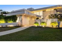 Modern waterfront home with landscaped yard and walkway at 3638 San Remo Ter, Sarasota, FL 34239