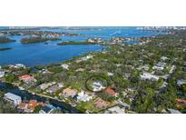 Aerial view showcasing a single-Gathering home nestled in a quiet residential neighborhood at 1411 Quail Dr, Sarasota, FL 34231
