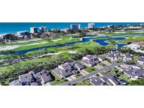 Aerial view of community, showcasing home's location and golf course views at 2195 Harbourside Dr # 404, Longboat Key, FL 34228