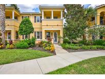 Attractive two-story townhome with landscaped yard and walkway at 3766 82Nd Avenue E Cir # 106, Sarasota, FL 34243