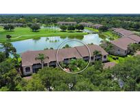 Aerial view of condo community near golf course and lake at 5251 Mahogany Run Ave # 524, Sarasota, FL 34241