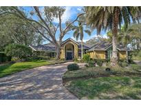 Beautiful 1-story home with a tile roof and lush landscaping at 662 Fernwalk Ln, Osprey, FL 34229