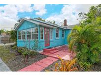 Charming light blue house with red door and walkway at 1330 Cocoanut Ave, Sarasota, FL 34236