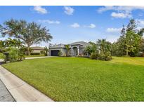 Spacious home with lush lawn and mature landscaping at 1604 21St W Ave, Palmetto, FL 34221