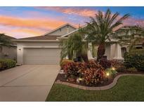 Attractive single-story home with landscaped yard and two-car garage at 4629 Garden Arbor Way, Bradenton, FL 34203