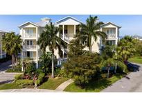 Three-story building with balconies and lush landscaping at 7910 34Th W Ave # 102, Bradenton, FL 34209