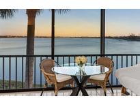 Enjoy breathtaking water views from this condo's relaxing seating area at 1602 Stickney Point Rd # 1602-301, Sarasota, FL 34231