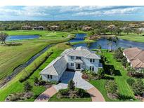 Luxury home with golf course views, situated on a lake at 3761 Founders Club Dr, Sarasota, FL 34240