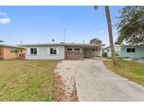 Ranch-style home with a carport and spacious yard at 4026 Indianapolis Ne St, St Petersburg, FL 33703