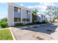 Light blue condo building with parking and landscaping at 5310 26Th W St # 501, Bradenton, FL 34207