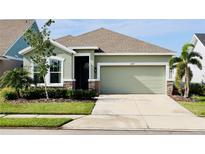 Curb appeal abounds in this charming one-story home featuring a two-car garage and well-manicured landscaping at 8307 Trimbelle Ter, Parrish, FL 34219