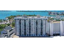 Aerial view of a modern high rise building with water and city views at 101 S Gulfstream Ave # 8G, Sarasota, FL 34236