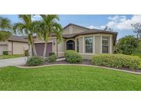 One-story home with landscaped lawn and attached garage at 10515 52Nd E Ct, Parrish, FL 34219