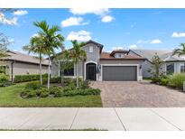 Beautiful two-story home with landscaped yard and driveway at 13146 Borrego St, Venice, FL 34293