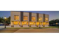 Modern townhome community with sleek design and nighttime lighting at 1778 10Th St, Sarasota, FL 34236