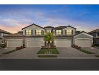 Attractive two-story home with three-car garage and landscaping at 6065 Worsham Ln # 104, Bradenton, FL 34211