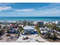 Stunning beachfront home with panoramic ocean views and lush tropical landscaping at 6473 Gulf Of Mexico Dr, Longboat Key, FL 34228