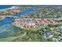Aerial view of waterfront community with resort-style amenities at 1618 Stickney Point Rd # 1618-202, Sarasota, FL 34231