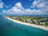 Aerial view of beachfront property with resort amenities at 240 Sands Point Rd # 4201, Longboat Key, FL 34228