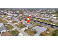 Aerial view of canal-front home with private dock at 4278 Mundella Cir, Port Charlotte, FL 33948