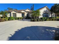 Luxury home with attractive landscaping and a large driveway at 5245 88Th E St, Bradenton, FL 34211