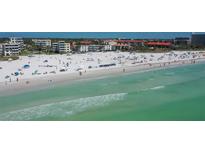 Aerial view of beachfront property with resort-style amenities at 6144 Midnight Pass Rd # 2N, Sarasota, FL 34242