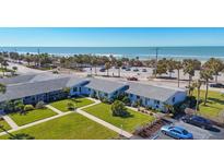 Aerial view of beachside property, showing building and ocean at 100 The Esplanade N # 1, Venice, FL 34285