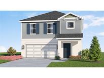 Two-story house with gray siding, white garage door, and landscaping at 13009 Cedar Elm Lane, Parrish, FL 34219