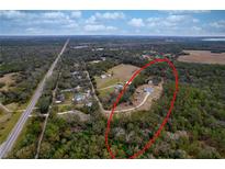 Aerial view of property showing home, detached shed and pond at 14150 Manatee Rd, Parrish, FL 34219