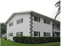Well-maintained building exterior with landscaping at 305 47Th Avenue W Dr # 143, Bradenton, FL 34207