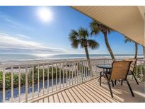Ocean view balcony with table and chairs, perfect for relaxing at 6701 Gulf Of Mexico Dr # 317, Longboat Key, FL 34228