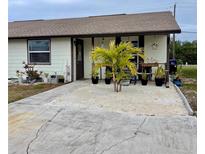 Adorable single story home with palm trees and sandy front yard at 7824 40Th Avenue W Dr # 7824, Bradenton, FL 34209