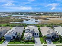 Luxury home community with preserve views; single-Gathering homes with tile roofs at 8050 Redonda Loop, Lakewood Ranch, FL 34202
