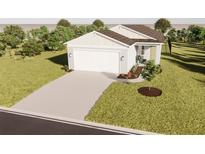 Single-story home with attached garage, landscaping, and neutral color palette at 13029 Cedar Elm Lane, Parrish, FL 34219
