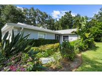 Well-maintained home with lush landscaping and a walkway at 5916 Bonaventure Pl, Sarasota, FL 34243