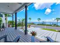 Relaxing waterfront porch with wooden deck and stunning view at 1914 Riverside E Dr, Bradenton, FL 34208