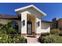 Inviting home exterior with landscaped walkway and entry at 5107 86Th Street W Ct, Bradenton, FL 34210