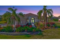 Luxury home with inviting landscaping and walkway at 210 166Th Ne St, Bradenton, FL 34212