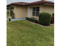 Well-maintained exterior with a manicured lawn and attractive landscaping at 3314 Mcdill Rd # 3314, Bradenton, FL 34207