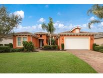Attractive single-story home with a two-car garage and landscaped lawn at 5203 Lake Overlook Ave, Bradenton, FL 34208