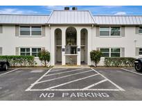 Front view of a condo building with parking at 5800 Hollywood Blvd # 115, Sarasota, FL 34231